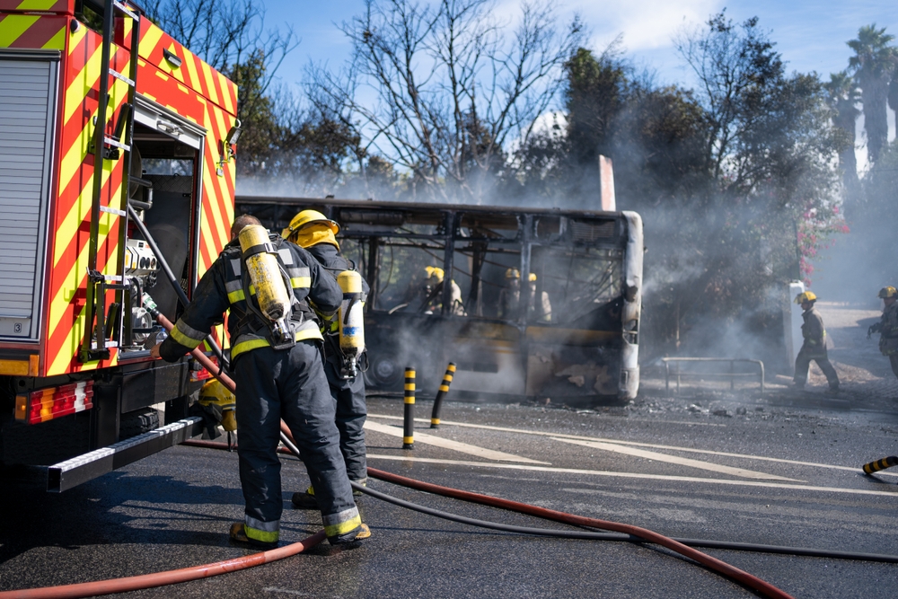 Firefighters responding to a car crash scene